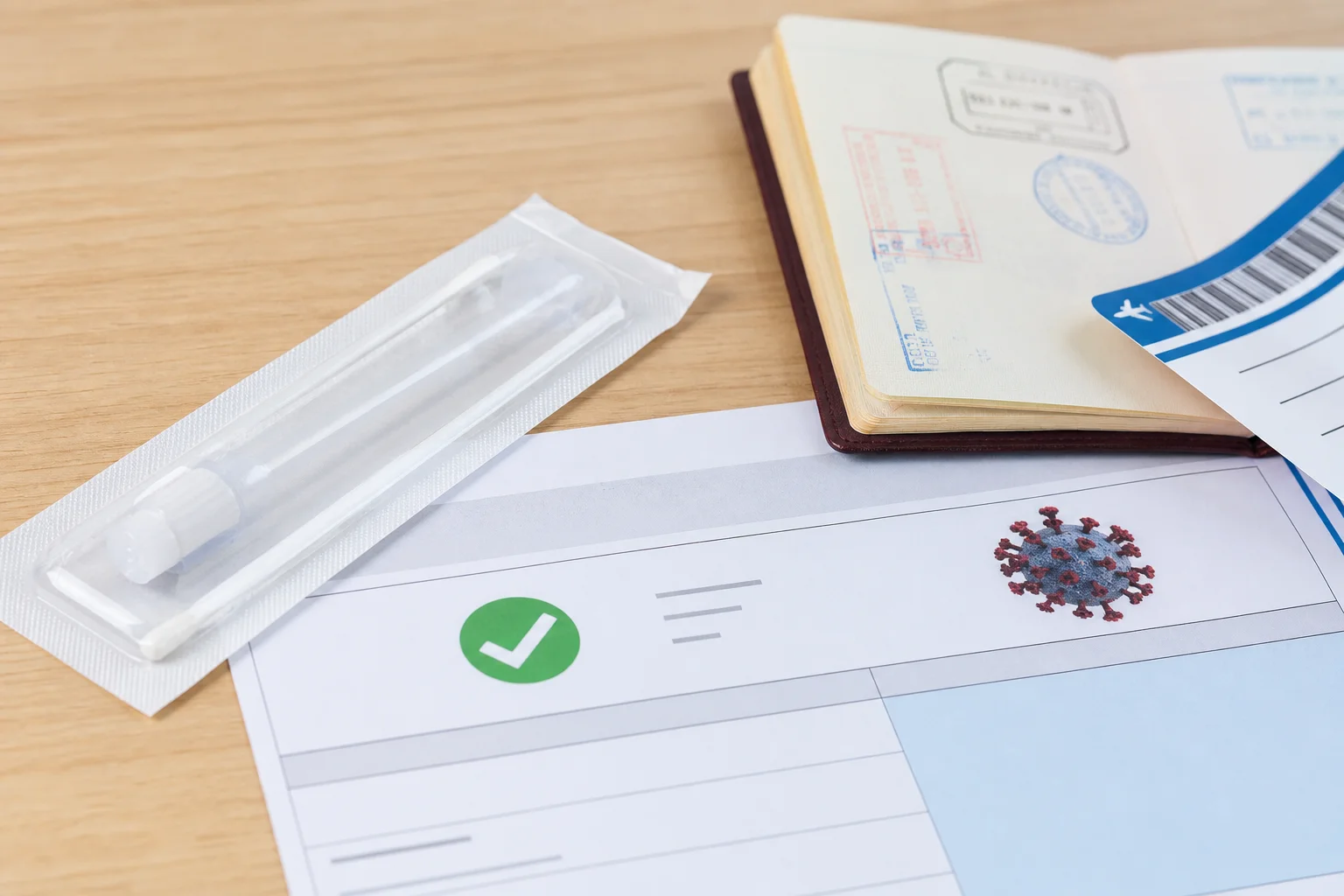 Nurse in travel health clinic attire reviewing vaccination records and travel documents with a patient preparing for an international trip